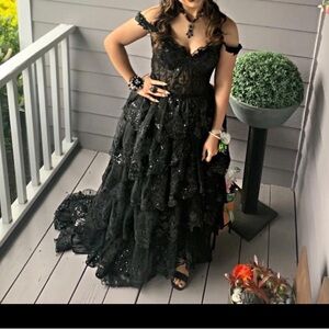 This is a black breeze bridal boutique in a size small with a built in corset.